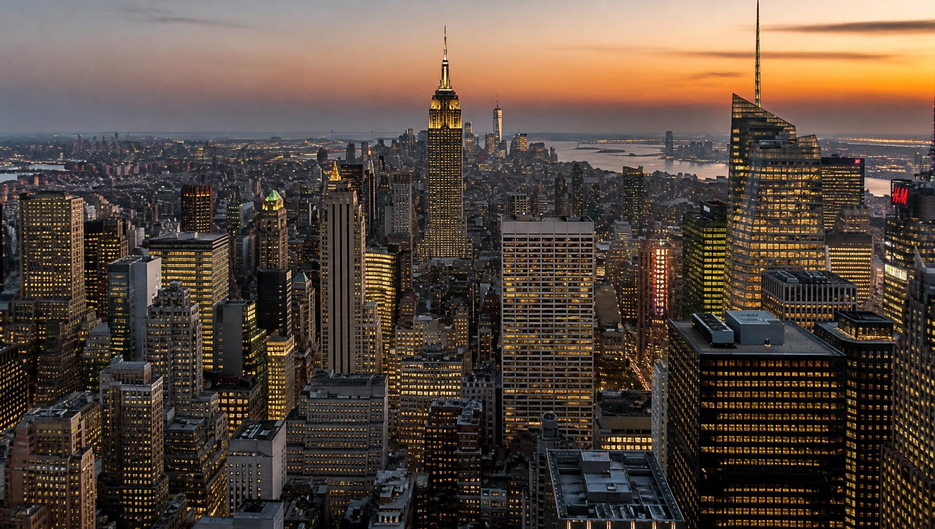 Downtown Manhattan skyline at dusk seen from the air